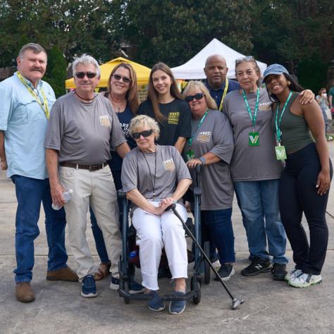 Group of people posing for photo. 