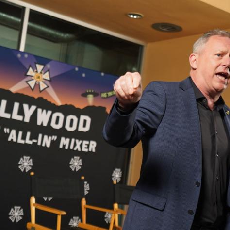 Man speaking into microphone. 