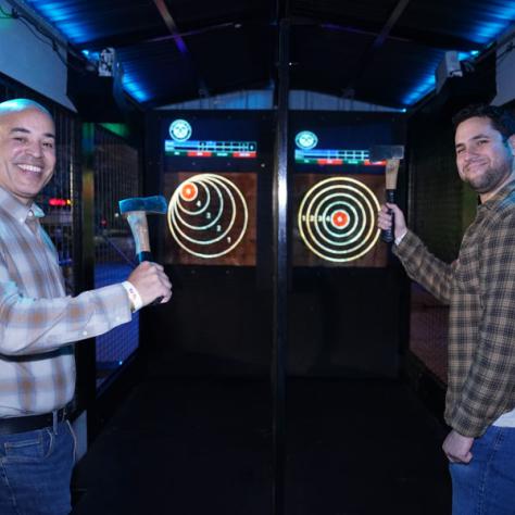 People playing darts. 