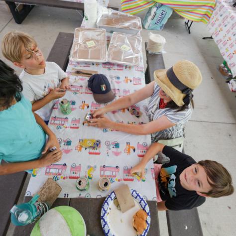 Kids at picnic table. 