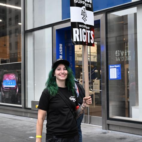 Woman with workers rights sign. 