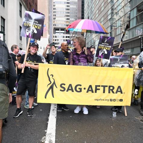 People marching in Labor Day parade.
