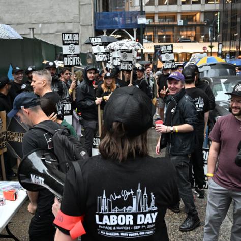 People marching in Labor Day parade.