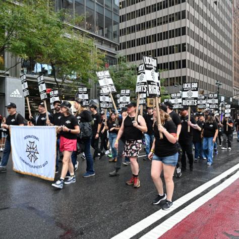 People marching in Labor Day parade.