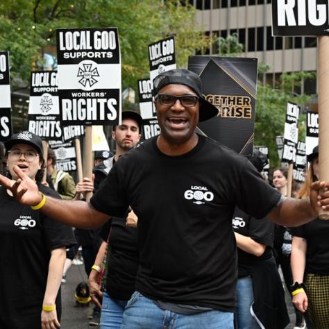 People marching in Labor Day parade.