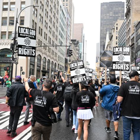 People marching in Labor Day parade.