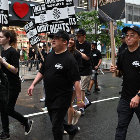 People marching in Labor Day parade.