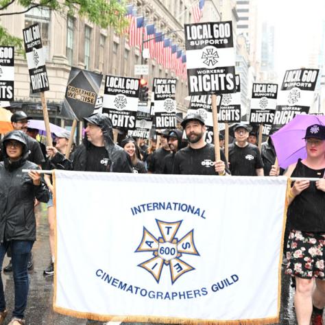 People marching in Labor Day parade.