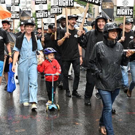 People marching in Labor Day parade.