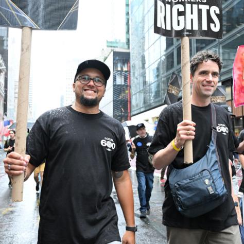 People marching in Labor Day parade.