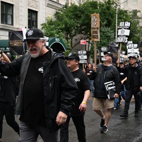 People marching in Labor Day parade.