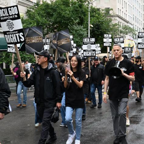 People marching in Labor Day parade.