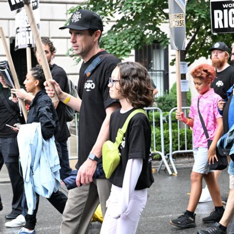 People marching in Labor Day parade.