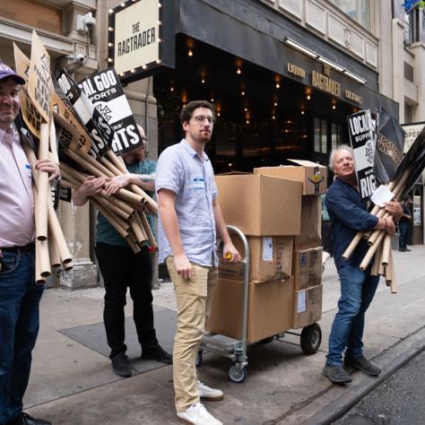 People holding signs. 