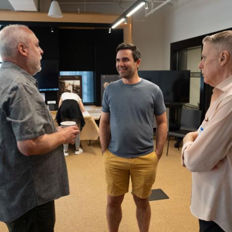 Three people talking. 