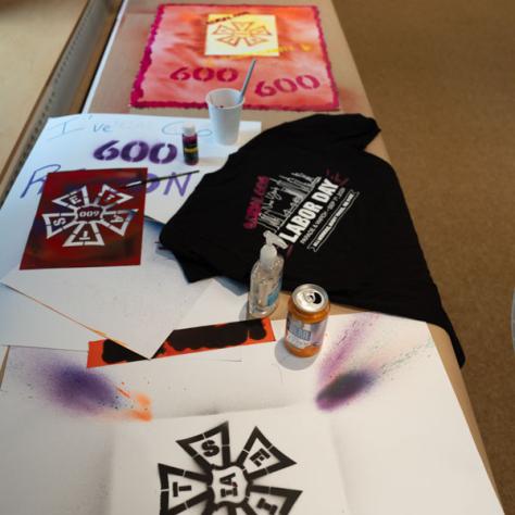 Photo of signs and shirt. 