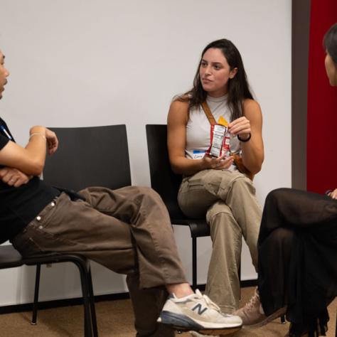 People talking in chairs. 