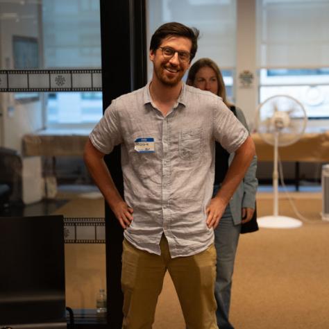 Man standing with arms on hips. 