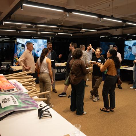 Photo of people talking. 