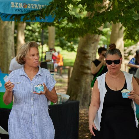 Women holding drinks. 