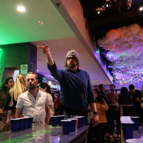 Candid photo of man playing party games. 