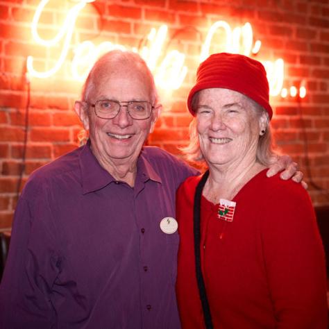 Two people posing for photo. 