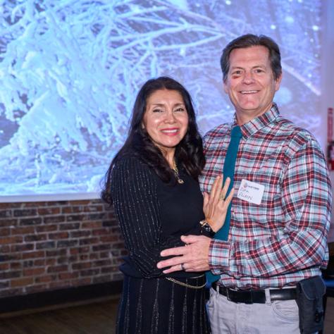 Two people posing for photo. 