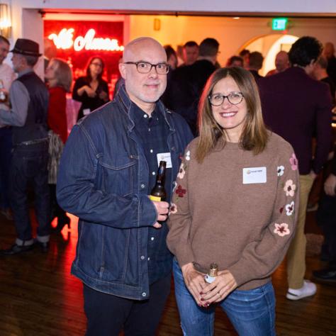 Two people posing for photo. 