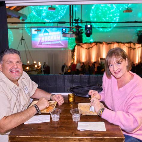 Two people posing for photo. 