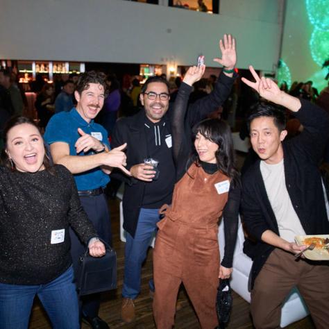 Group of people posing for photo. 