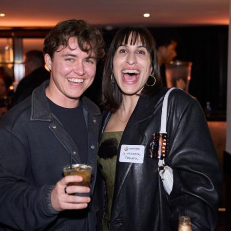 Two people posing for photo. 