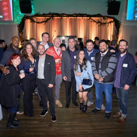 Group of people posing for photo. 