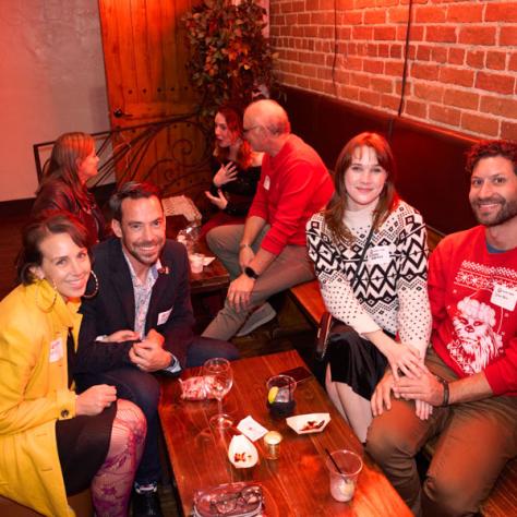 Group of people posing for photo. 