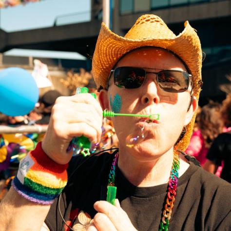 Man blowing bubbles.
