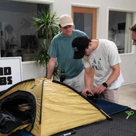 Men with tiny tent. 