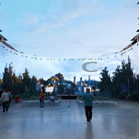 People standing in large space. 