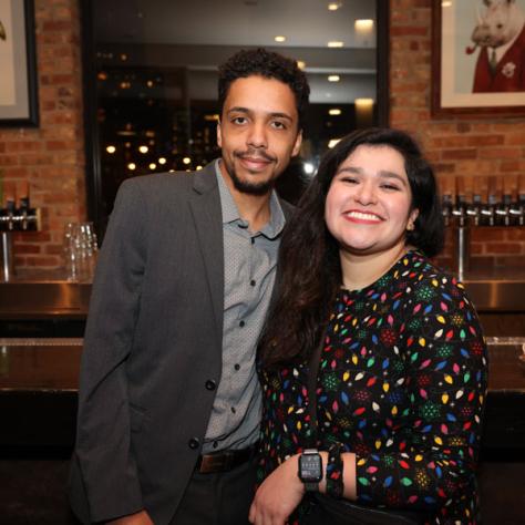 People posing for photo at party.