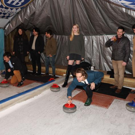 People playing shuffleboard. 