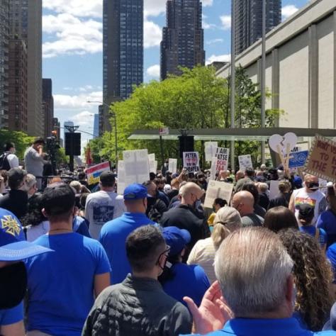 People at a rally from behind. 
