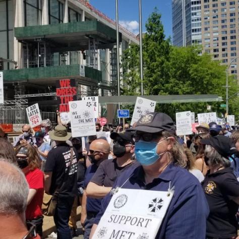 People at a rally with signs. 