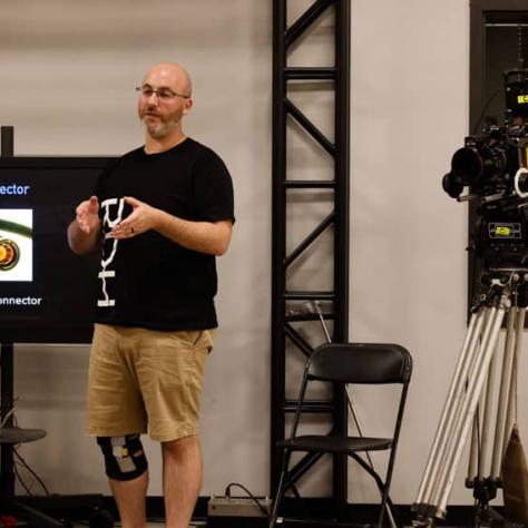 Man standing in front of audience. 