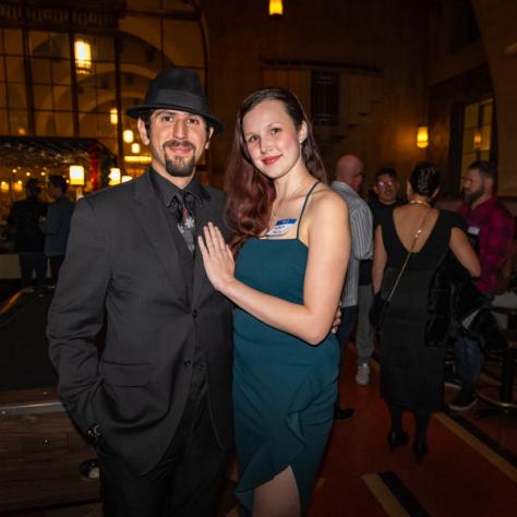 People posing for photo at party.