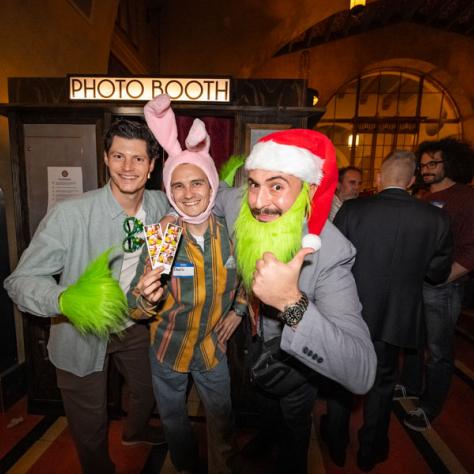 People posing for photo at party.