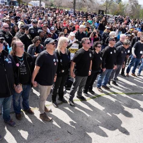Line of people at rally. 
