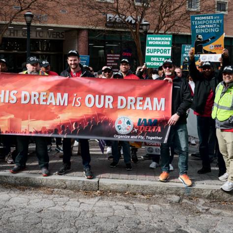 People marching with banner. 