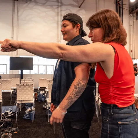 Liz Cash at the SOC's Camera Operator Workshop, giving pointers to Local 600 Digital Utility Krisel Magana.