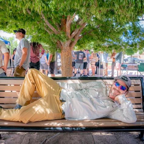 Woman posing on bench. 