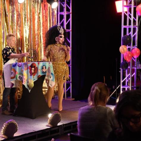 DJ and drag queen on stage. 