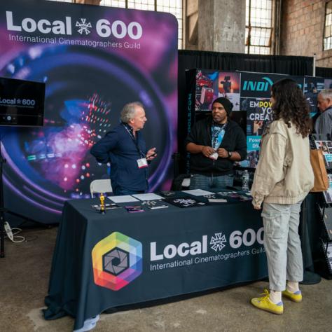 Person talking to Local 600 vendor. 
