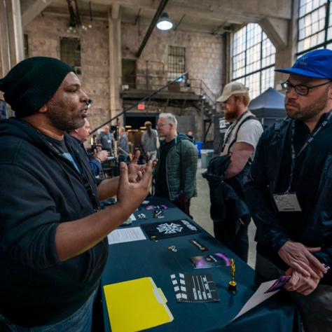 Person talking to Local 600 vendor. 
